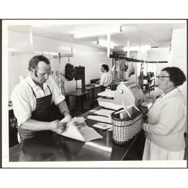 Butcher serving his mother