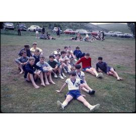 Boys sitting on grass