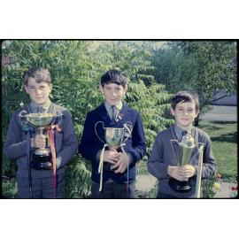Three boys with trophies