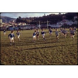 Boys playing rugby at Logan Park