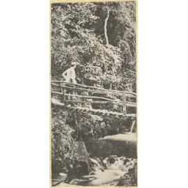 Figure on a bridge