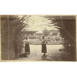 Three figures and a dog