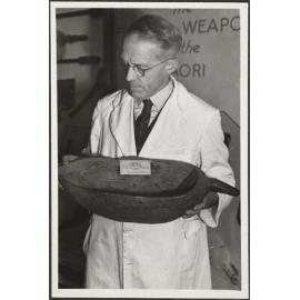 H.D. Skinner holding a kumete roroa (wooden food bowl)