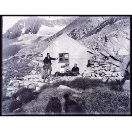 Alec Graham, Peter Graham, and three other people at an unidentified hut