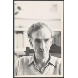 Charles Brasch in a chair