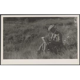  [Henry Brasch] reading outdoors