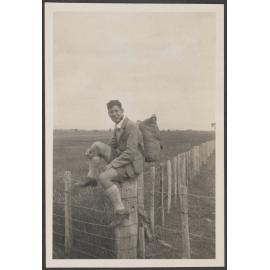 [James Bertram] sitting on a fence