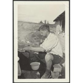 Toss making pancakes, the first breakfast