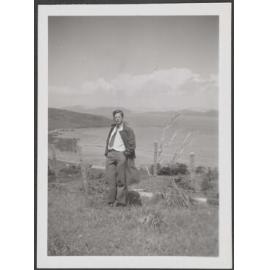Man with coastal view behind