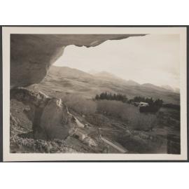 View from rocky hillside over rural landscape