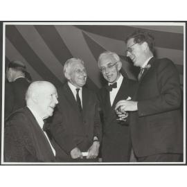 Trevor, [?], Jack Edmund Blunden and Sir David Ross at a party