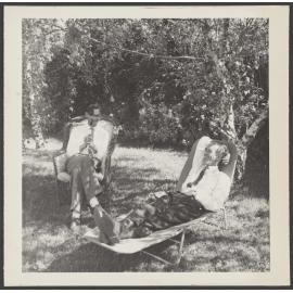 W.H. Oliver and Charles Brasch sitting under a tree