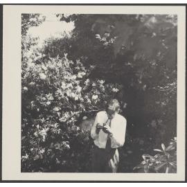 W.H. Oliver lighting a pipe