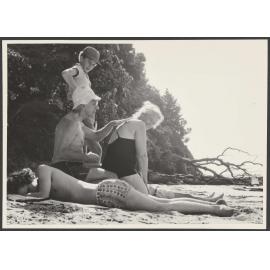 Jack and Gwyneth Bennett with two boys on a beach