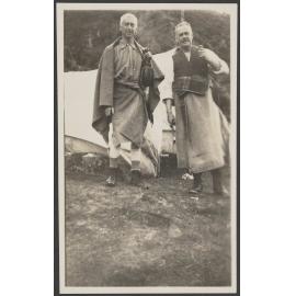 Two men in front of tent