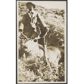 Man with a dead stag