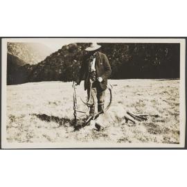 Man with a dead stag