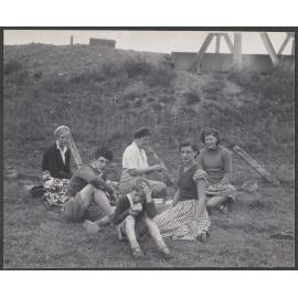 Hamilton family having picnic by bridge
