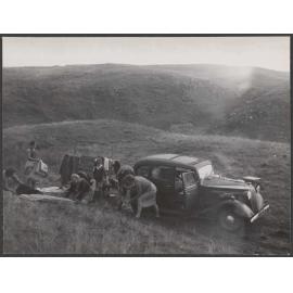 Bettina Hamilton and five of her children packing up their car