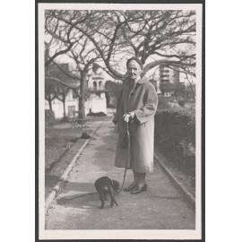 Ethel Englefield on the street with a dog