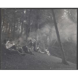 Bettina Hamilton and five of her children with another group in a forest