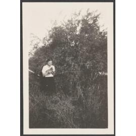 Mildred Little eating a pomegranate