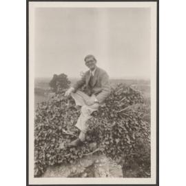 Unknown man sitting in bush