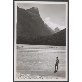 Man looking towards mountain range