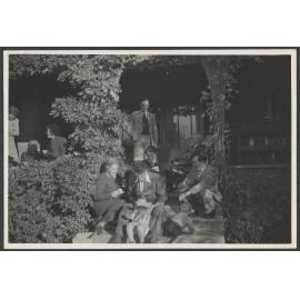 Group of people on porch and steps