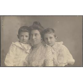 Unidentified woman and two boys