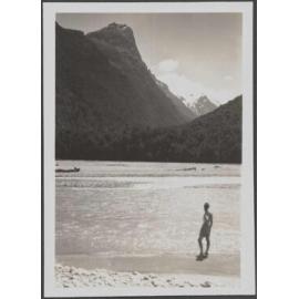 Unidentified man [Charles Brasch?] by a river