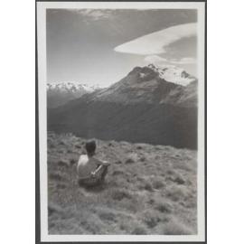 Unidentified man [Charles Brasch?] overlooking a mountain range