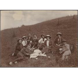Picnic group sitting on hillside