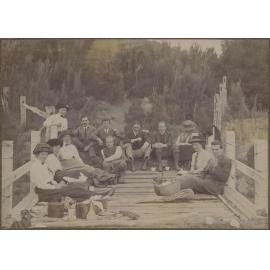 Family picnic, sitting on a pier