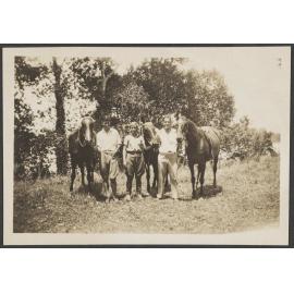 Three men with horses