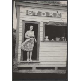Woman at the front door of a store