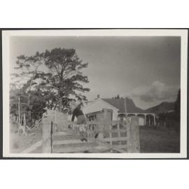 Young child climbing a fence