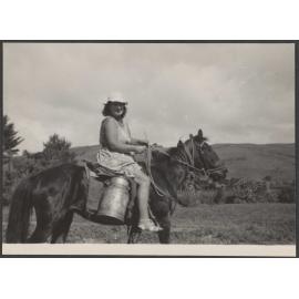 Woman riding a horse