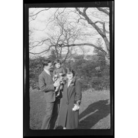 Man and woman holding a young girl