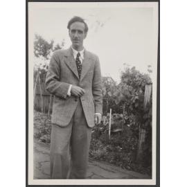 Charles Brasch in a garden