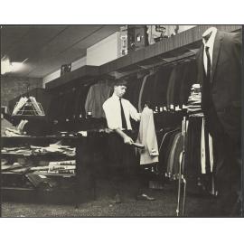 Shop interior and staff member at Hallensteins, Whangārei