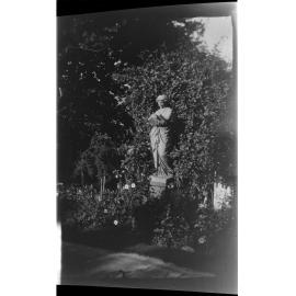 Statue in garden setting