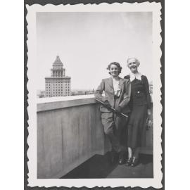 Two unknown women on a rooftop