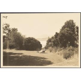 Unknown woman seated overlooking Governor's Bay