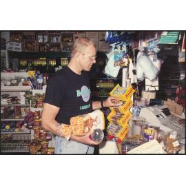 Customer in dairy with Europe bars