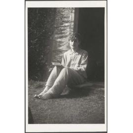 Young man sitting on a cushion