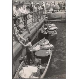 Selling fresh fish alongside Galata Bridge