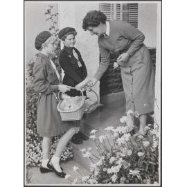 Girl Guide and Brownie selling biscuits at Invercargill
