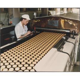 Worker with Baker Perkins electric biscuit oven