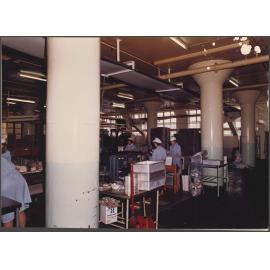 Finger Biscuits. General view of packing end with overhead cooling conveyors in the background.
